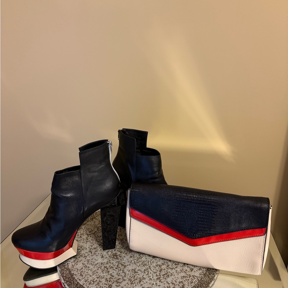 Chic Black, Cream, and Red Leather Clutch